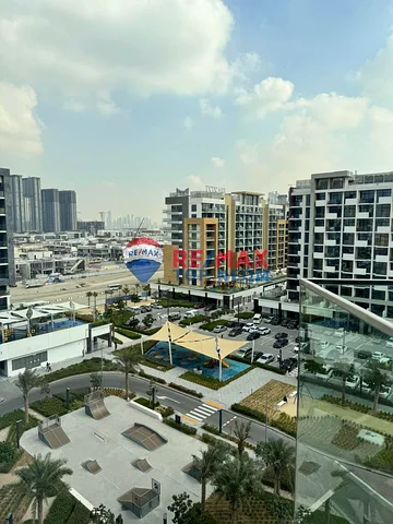 Azizi Riviera Meydan community amenities including swimming pools and landscaped outdoor areas