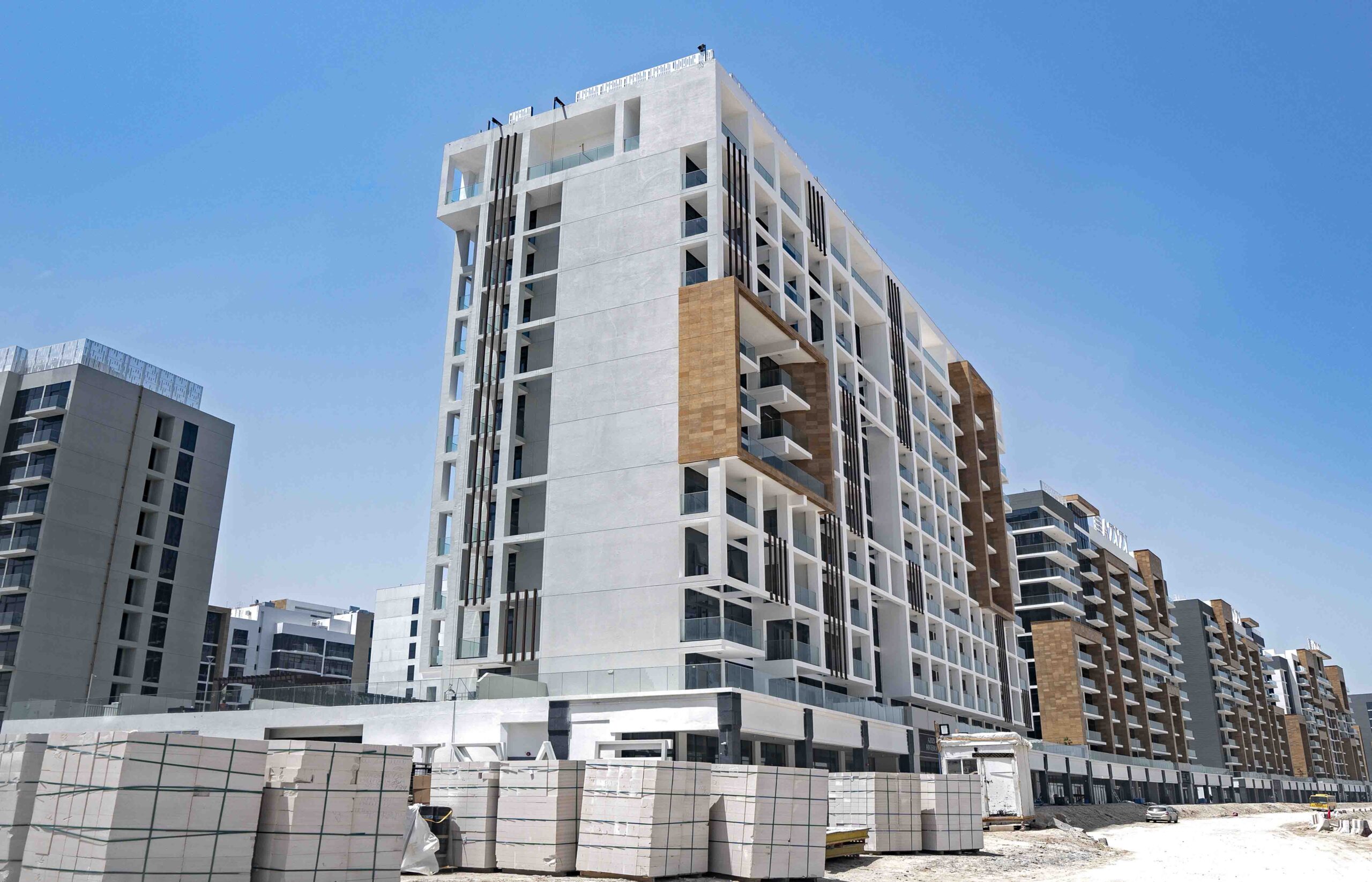 Azizi Riviera Meydan Community Overview Dubai Aerial view of Azizi Riviera in Meydan showing waterfront buildings and landscaped community areas in Dubai.