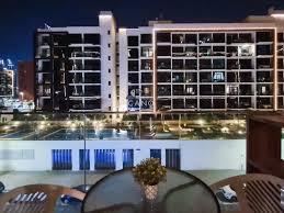 Waterfront lifestyle image of Azizi Riviera in Meydan featuring promenades, retail spaces, and modern residential buildings.